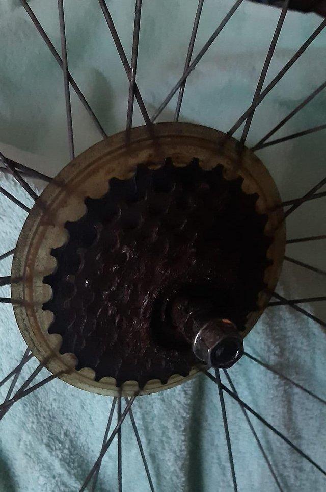 Preview of the first image of 700c bike wheel - back - alloy - needs adjustment to spokes.