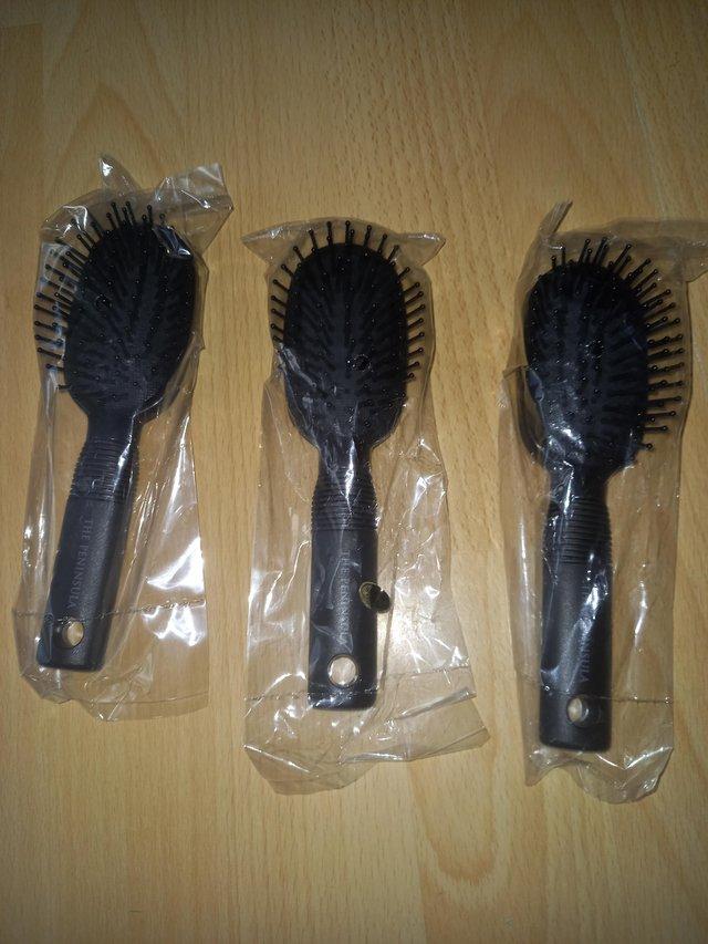 Preview of the first image of Individually wrapped mini hairbrushes.