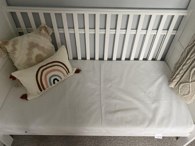Preview of the first image of White wooden cot bed with mattress.