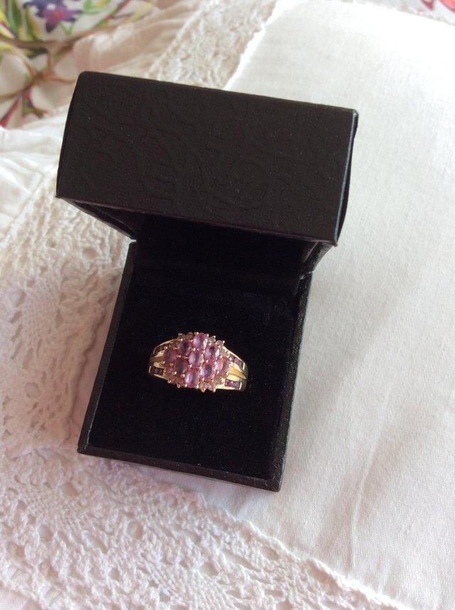 Preview of the first image of Large imposing amethyst gold ladies dress ring.