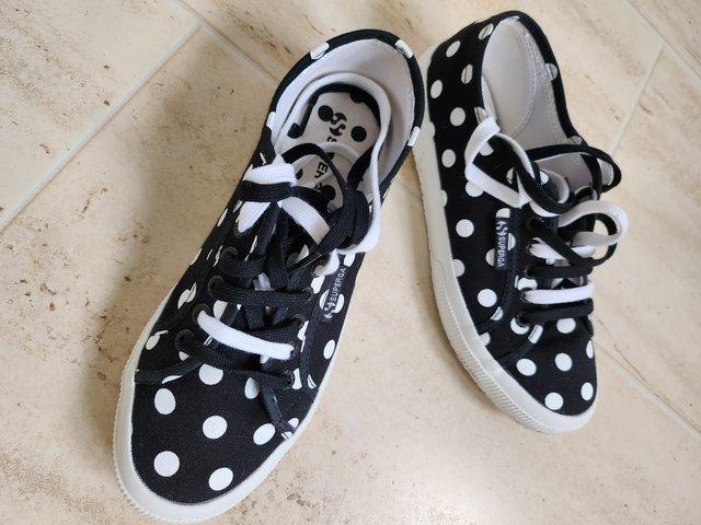 Preview of the first image of Superga black and white dots plimsolls.
