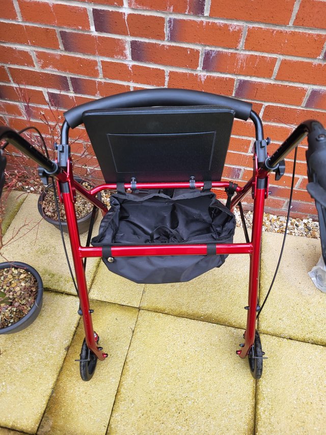 Preview of the first image of Foldaway walker with shopping bag and seat.