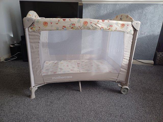 Preview of the first image of Mothercare bassinet travel cot/playpen.