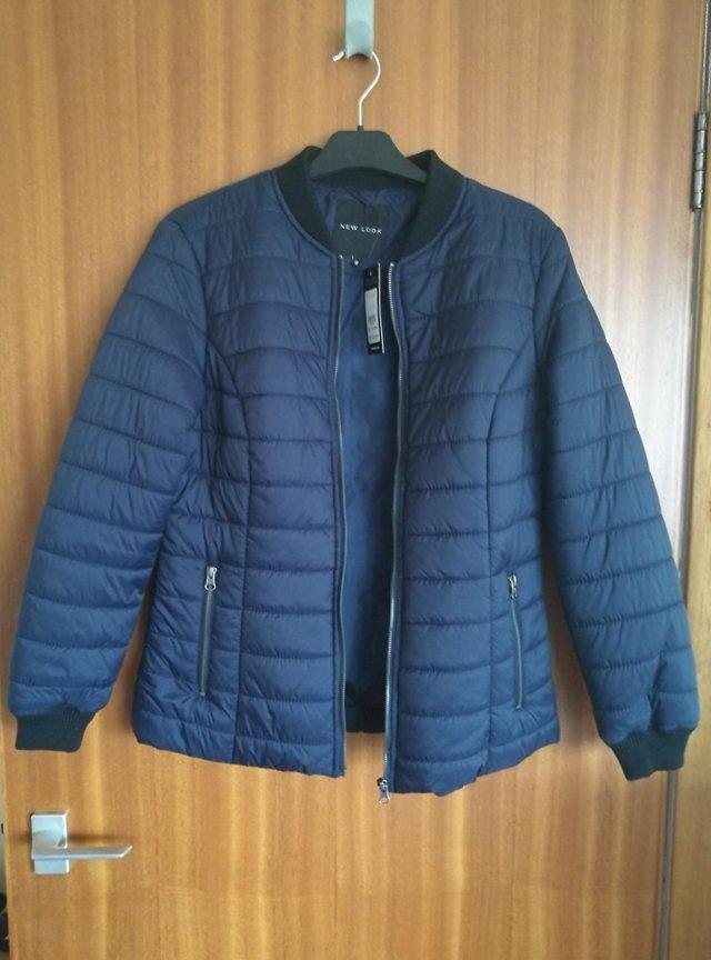 Preview of the first image of Navy Puffer Jacket, Size 12, Brand New.