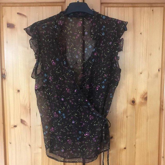 Preview of the first image of Betty Jackson Black sequined X-over sleeveless top. Size 12..