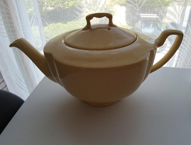Preview of the first image of Golden dawn yellow teapot.