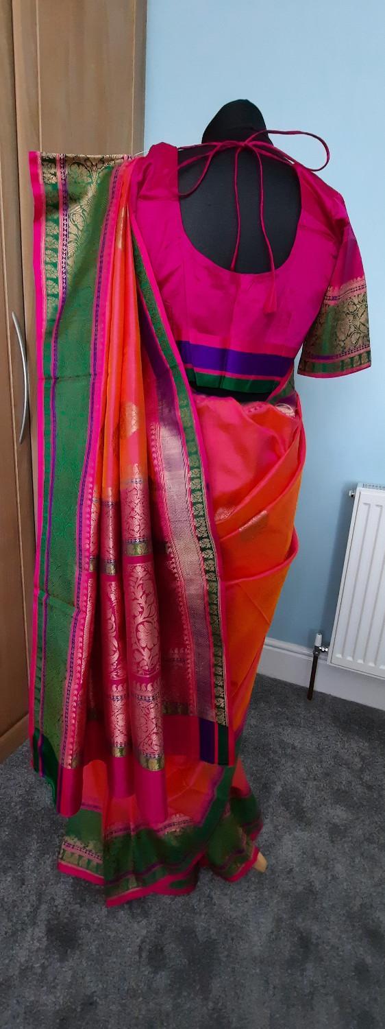 Preview of the first image of Pink, green and gold embrodiery design banarasi silk saree.