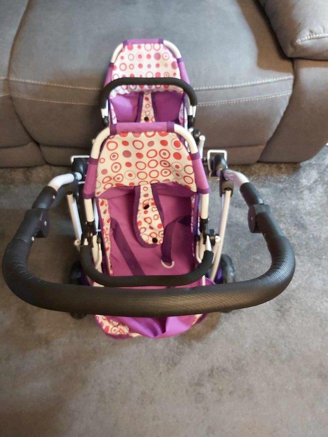 Preview of the first image of Doll's Double Buggy In Purple.