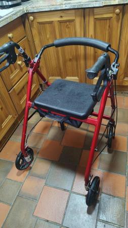 Image 1 of 4 wheeled walker never used outside