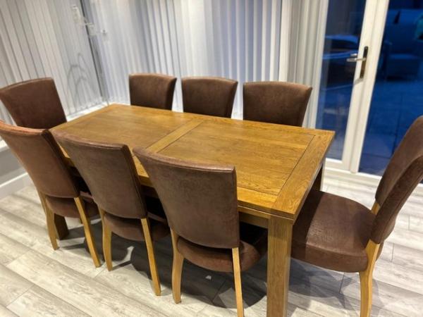 Image 2 of solid oak extendable table and 8 chairs