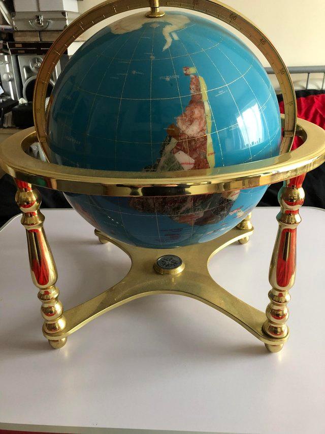 Preview of the first image of Gem stone globe with compass on stand.