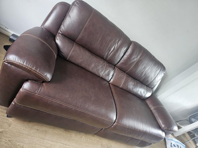Preview of the first image of Brown leather sofa  with recliner.