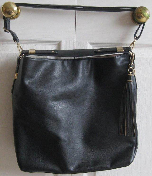 Preview of the first image of Large Black bag by Warehouse....