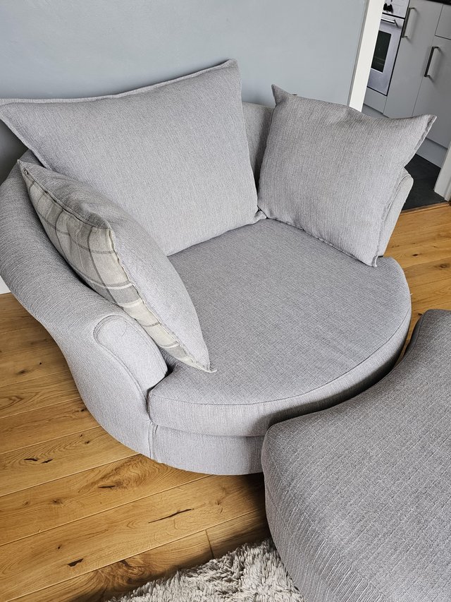 Preview of the first image of 2 two seater sofas plus cuddle chair with foot stool.