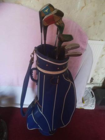 Image 2 of Golf bag with assortment of 5 woods driver &2putters blue go