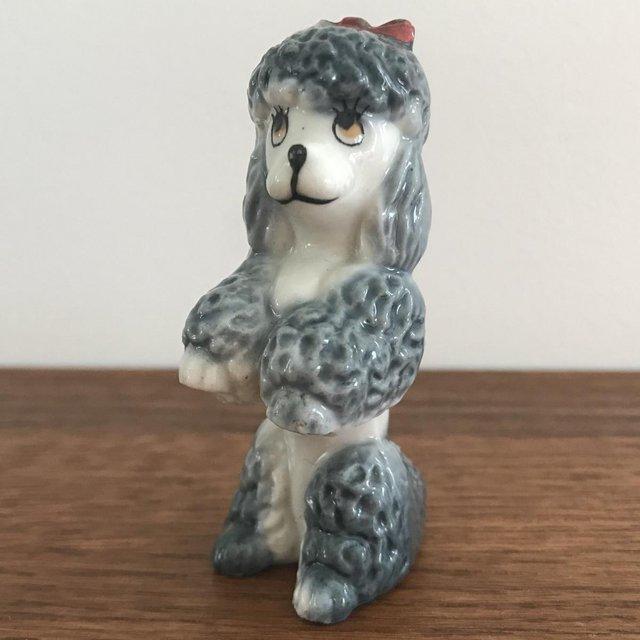 Preview of the first image of Vintage 1960's poodle, dog ornament. Small chip..