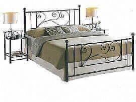 Image 1 of A sturdy metal bed frame in black with swirl design