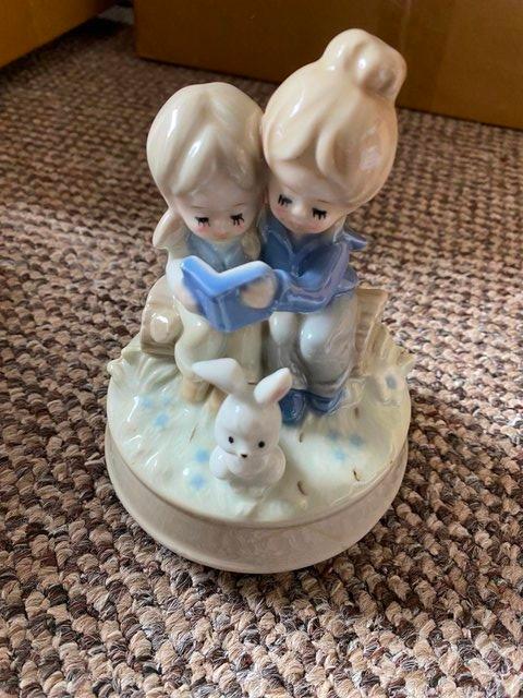 Preview of the first image of Vintage China boy and girl Bedtime story musical ornament.