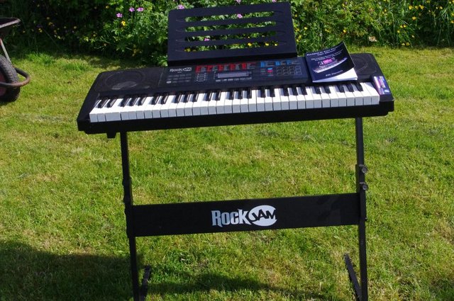 Preview of the first image of Rockjam 61 keys keyboard with user manual and stand.