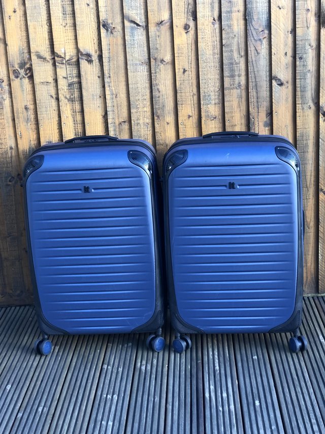 Preview of the first image of Pair of Large IT Blue Hard Shell Suitcases.