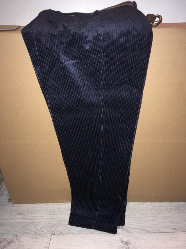 Preview of the first image of NAVY CORDUROY TROUSERS LIKE NEW.