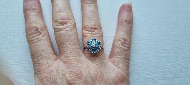 Preview of the first image of Aquamarine and diamond cluster ring – 18ct white gold.