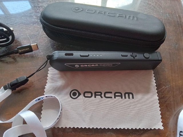 Preview of the first image of ORCAM READ SMART - AI Reading Aid (Hardly Used).