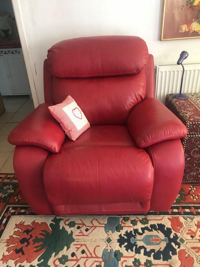 Preview of the first image of A pair of Red quality leather reclining armchairs as new.