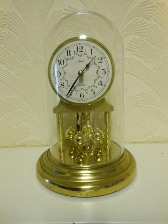Image 1 of Anniversary clock.- Polished brass finish with acrylic dome