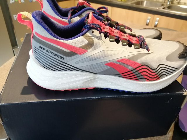 Preview of the first image of New boxed 7.5 Reebok trail shoes.