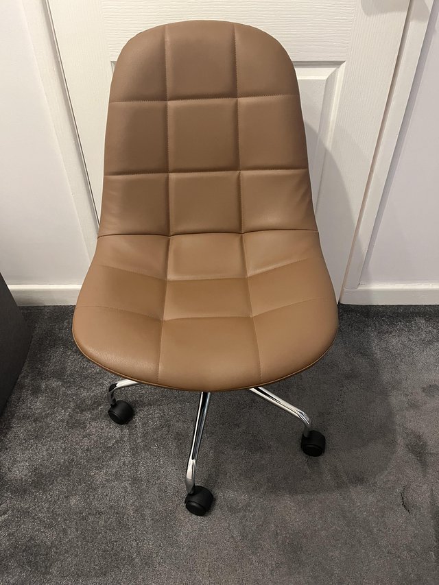 Preview of the first image of Faux leather swivel desk chair.