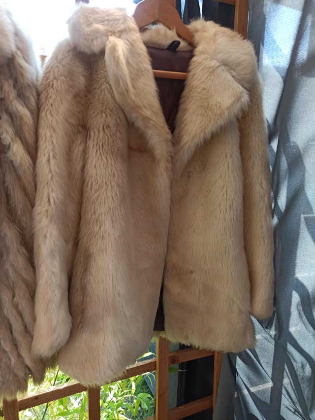 Preview of the first image of Faux fur coat with matching hat.