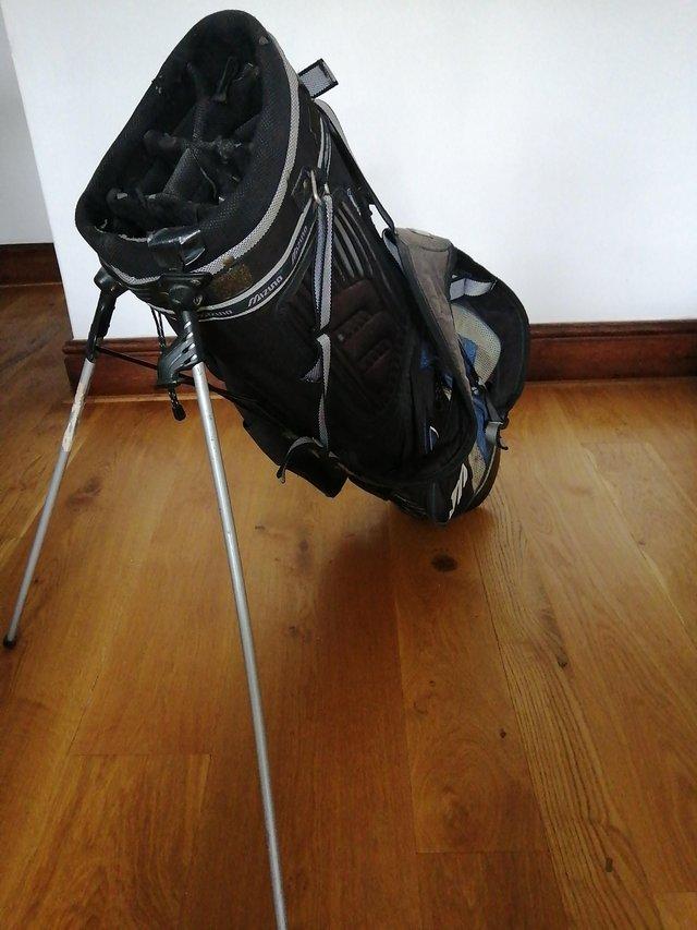 Preview of the first image of Mizuno golf bag with double shoulder strap and stand.
