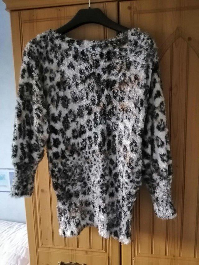 Preview of the first image of New Leopard Print Fluffy Jumper Size 12/14.