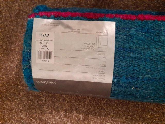 Preview of the first image of John Lewis Rug - Brand New with Labels.