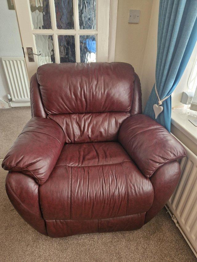Preview of the first image of 2 brown leather chairs including recliner.