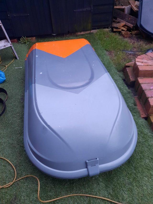 Preview of the first image of Large car roof box grey /orange.