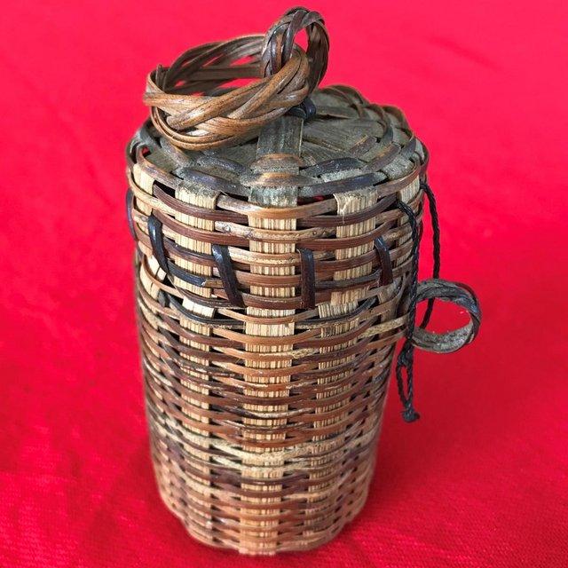 Preview of the first image of Vintage lidded cylindrical basket + original contents!.