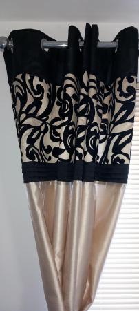 Image 1 of Black topped gold coloured lined curtains