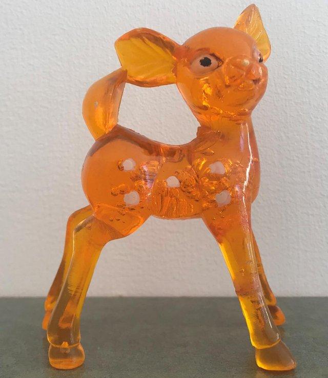 Preview of the first image of Vintage kitsch orange plastic deer figurine. Can post..