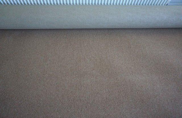 Preview of the first image of New Unused Roll of Carpet 20m2 (5+ x 4 metres) Neutral Brown.