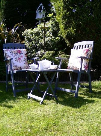 Image 2 of Set of wooden 2 garden carver chairs with cushions and side
