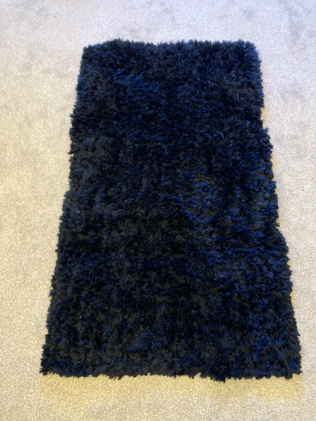 Preview of the first image of Dark blue rug for sale ..