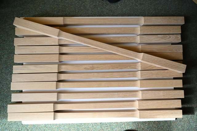 Preview of the first image of 12 new oak stair spindles.