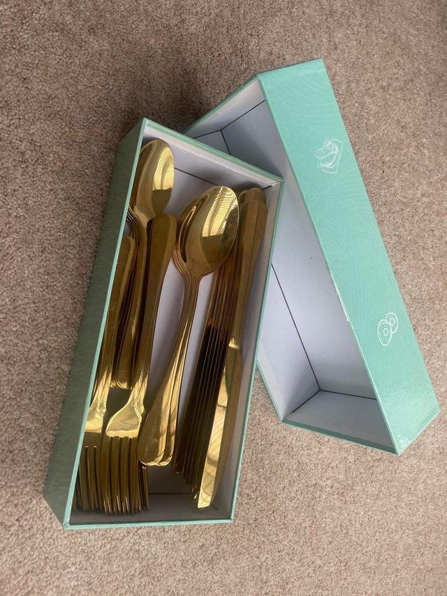 Preview of the first image of 50 gold mirror finished cutlery sets.