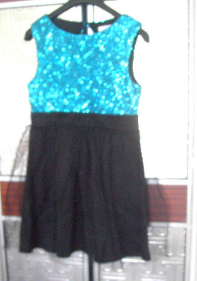 Preview of the first image of LADIESLACY DRESS BY LIPSYSIZE 12.