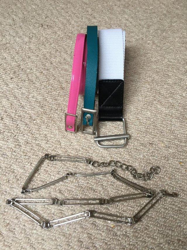 Preview of the first image of 4 belts,various colours/designs:metal,white, pink, turquoise.