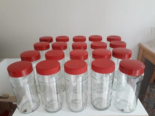 Preview of the first image of 24 LARGE GLASS STORAGE JARS FOR FREE.