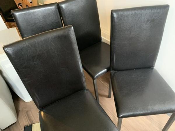 Image 3 of Four black faux leather dining chairs