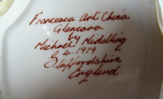 Preview of the first image of A STAFFORDSHIRE CHINA FIGURINE..